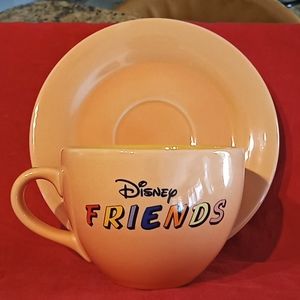 Disney "Friends" Oversized Mug With Saucer. Color: Peach & Mug is Yellow inside.